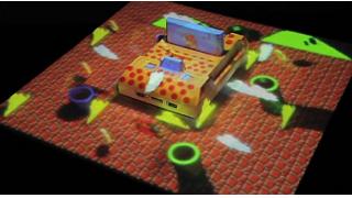 これぞ8bitと先端技術の融合！ ファミコンに投影されたマリオなどのプロジェクションマッピング